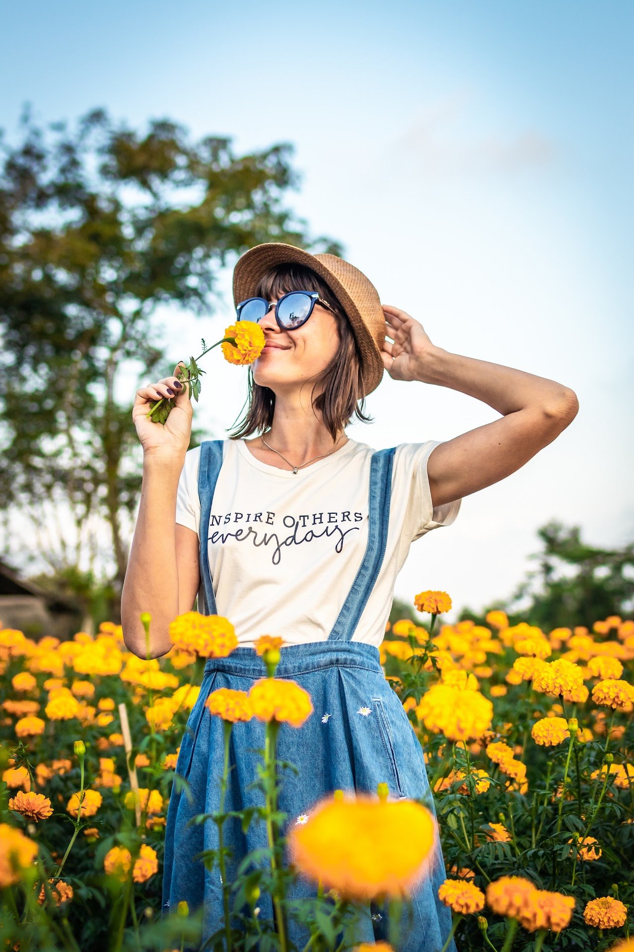 Close-up of a woman smelling a flower