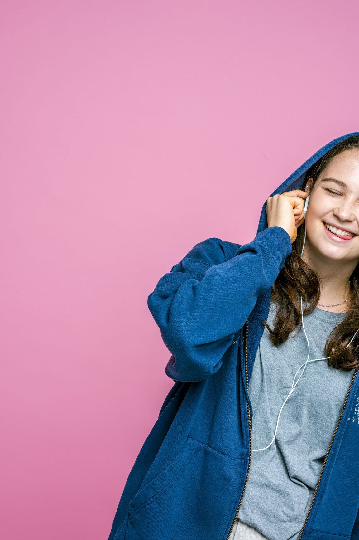 Close-up of a student girl listening to music.