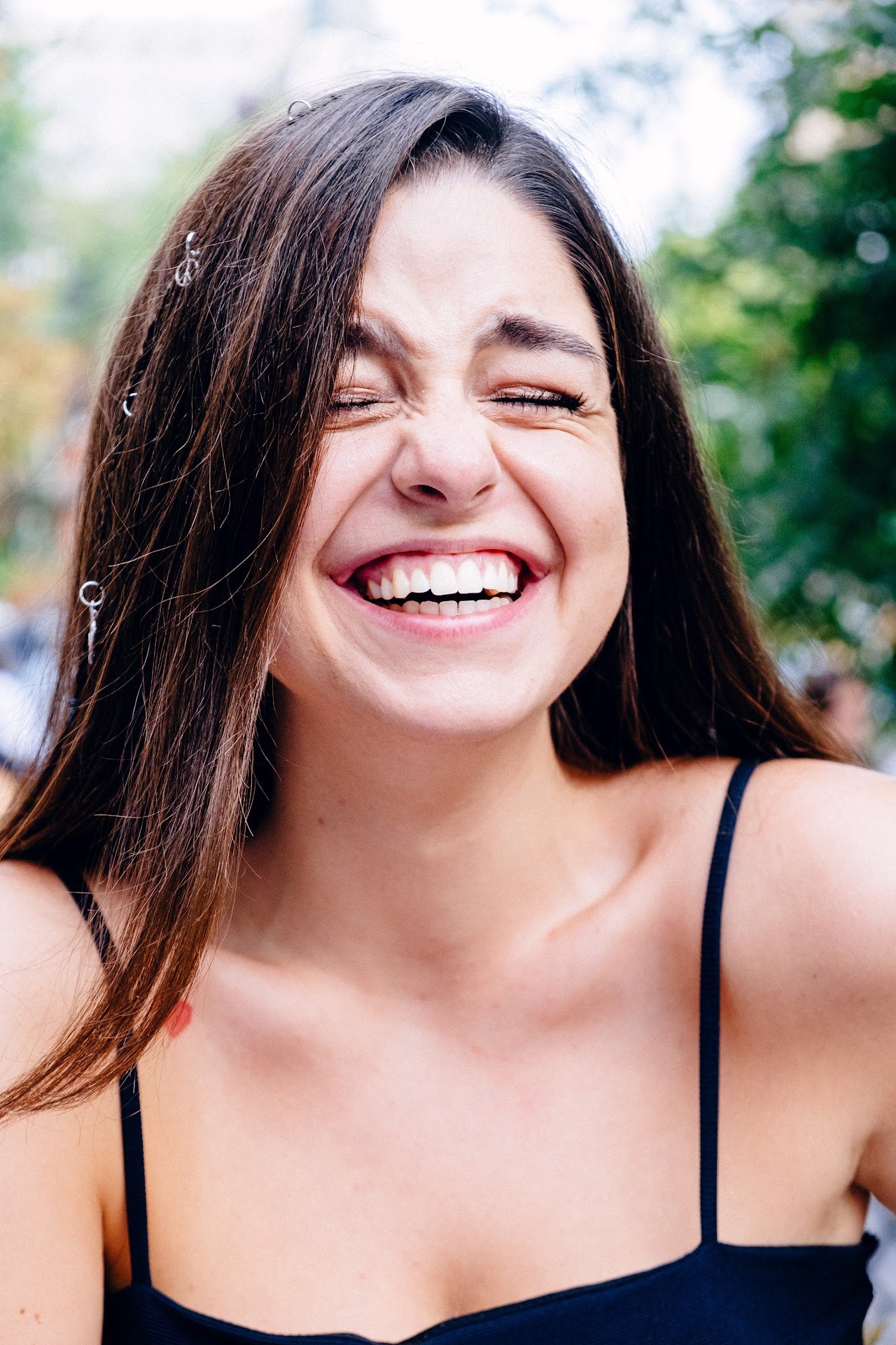 Close-up of a young girl.Smiling. The gingivas are visible. Gingivas are healthy.